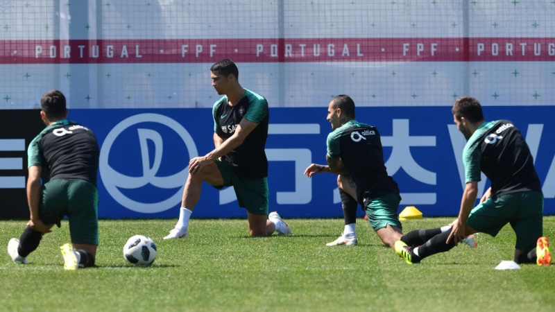 Iranpress: World Cup 2018: Ronaldo, Portugal squad train ahead of Morocco clash