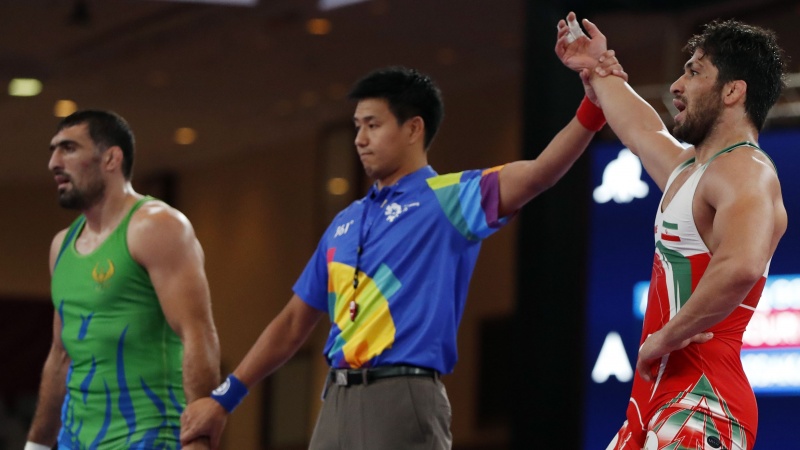 Iranpress: Asian Games: Two Gold for Iranian wrestlers