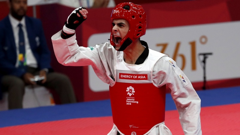 Iranpress: Asian Games 2018: Taekwondo Athlete Mirhashem Hosseini scoops Iran