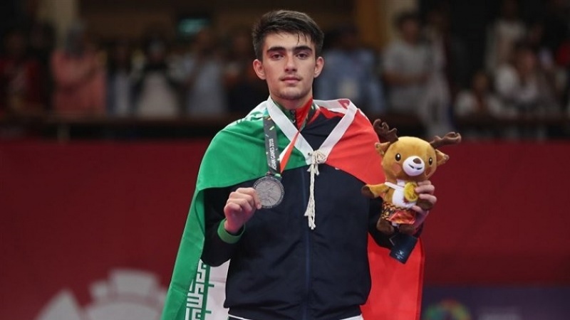 Iranpress: Asian Games 2018: Iranian Taekwondo Athlete Bakhshi wins silver medal
