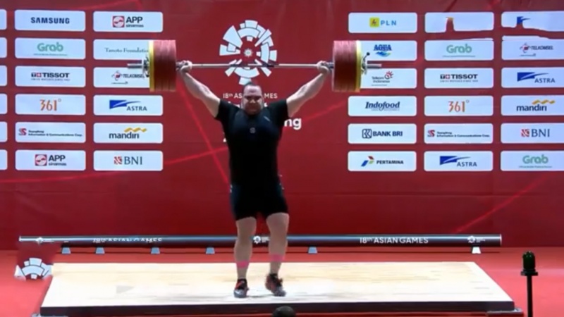 Iranpress: Asian Games 2018: Behdad Salimi collects a precious gold medal in weightlifting
