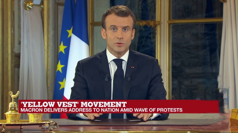 Iranpress: Macron raises minimum wage, announces tax cuts to appease violent protests