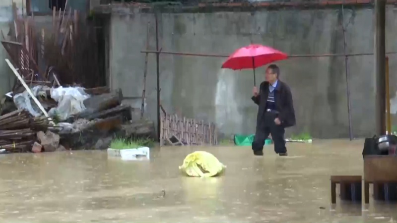 Iranpress: Heavy rainfall batters east China, dozens dead or missing