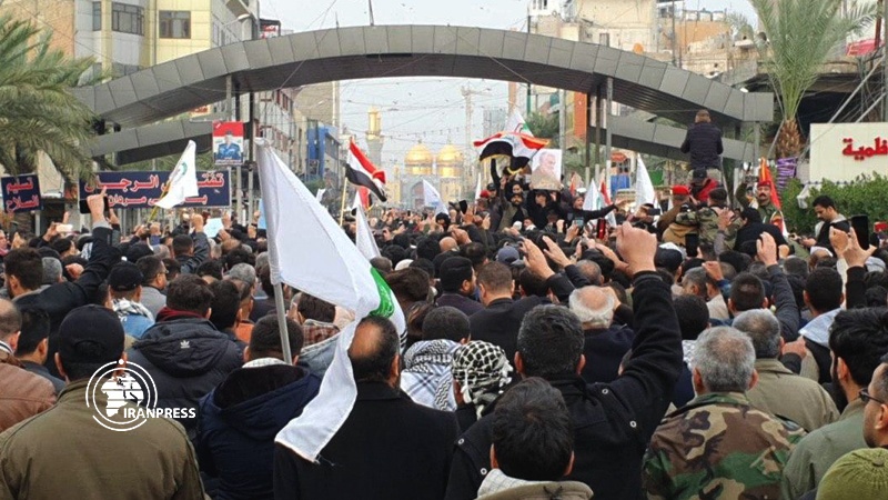 Iranpress: Large crowd of Iraqi people attend funeral of Resistance Front martyrs