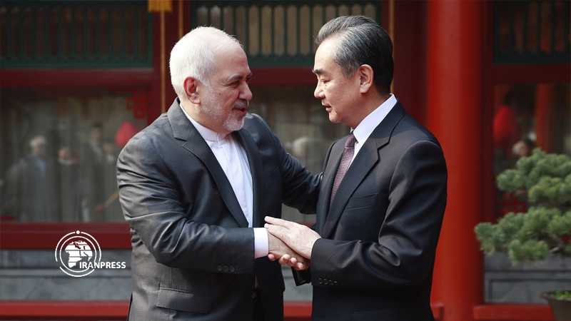 Iranpress: Zarif lauds China’s anti-COVID19 aid, condemning US sanctions