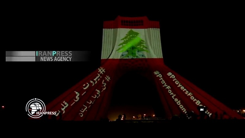 Iranpress: Azadi tower lit up as a sign of solidarity between Iran and Lebanon