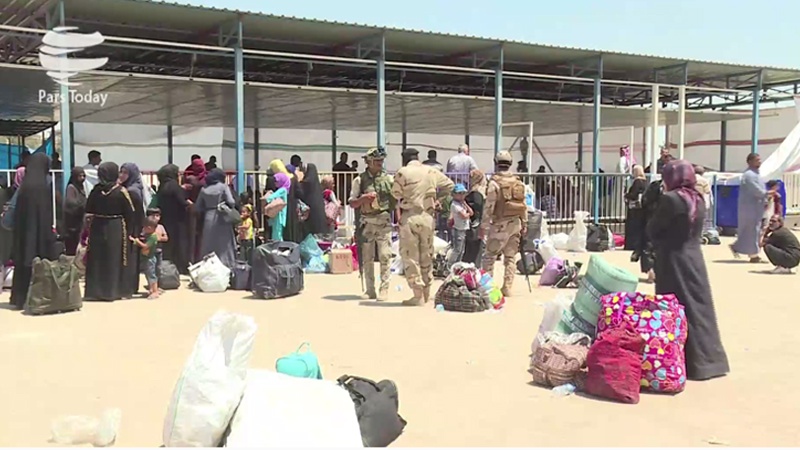 Iranpress: کمک رسانی ارتش عراق به آوارگان موصل/ویدئو