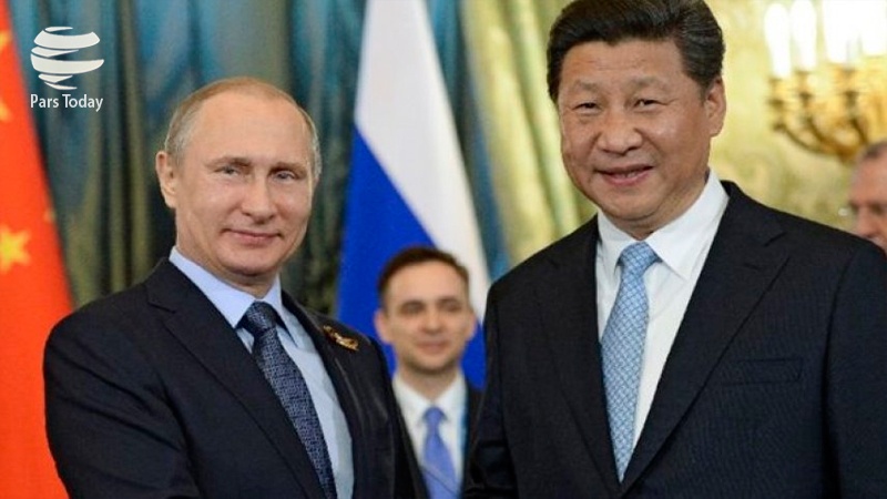 Iranpress: همکاری روسیه و چین در مقابله با سلطه دلار/ تحلیل